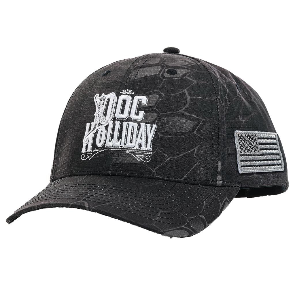 Black and dark gray reptile-patterned baseball cap featuring a white embroidered 'DOC HOLLIDAY' logo on the front and an American flag patch on the side.